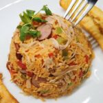 🍗🇨🇴 ¡Delicioso arroz con pollo en Colombia! Descubre las mejores recetas y sabores tradicionales